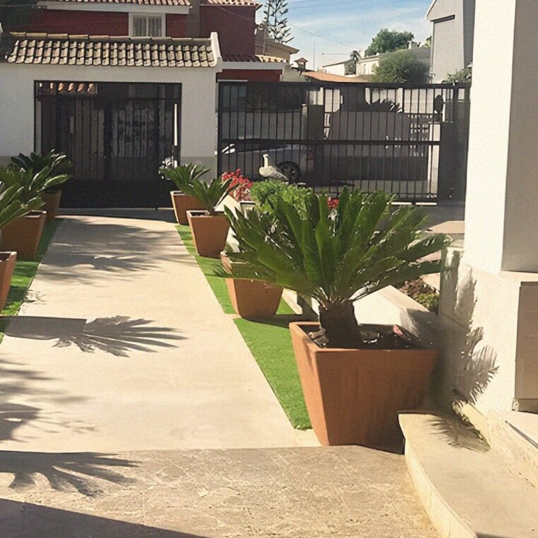 Terracotta pots along the entrance path